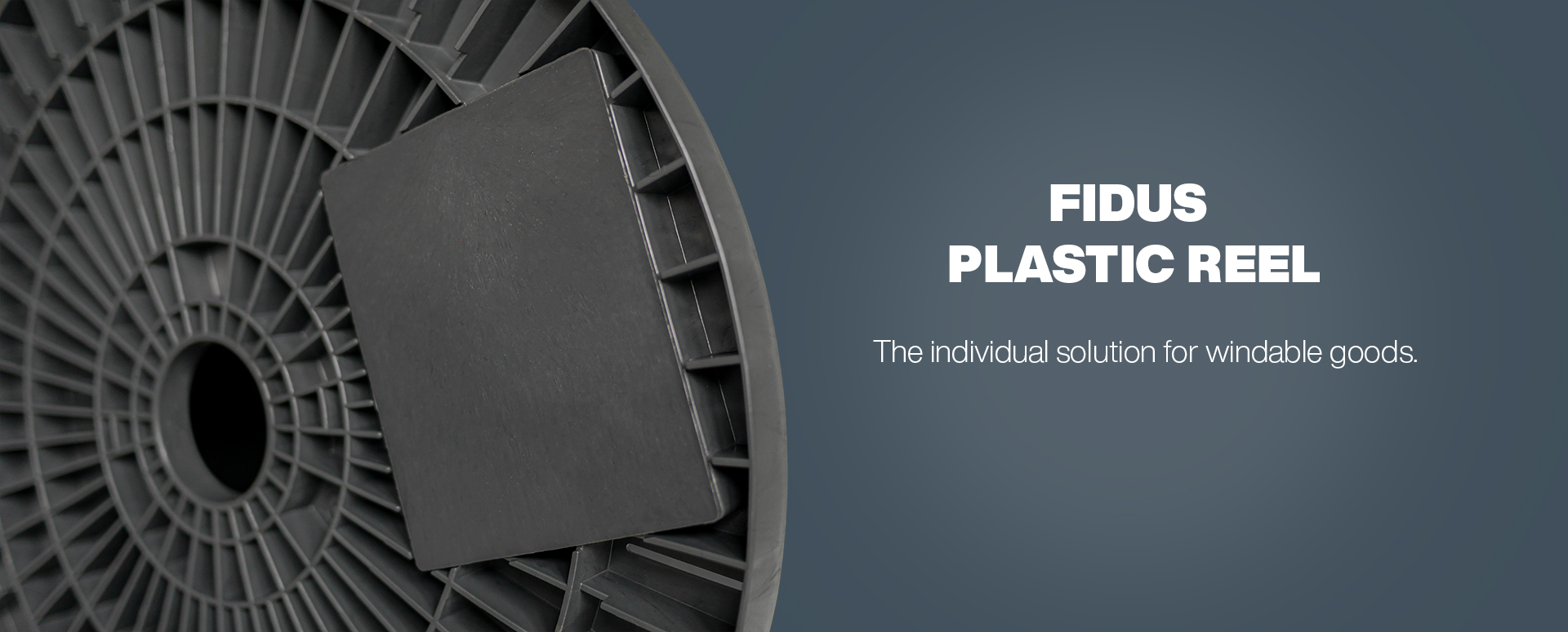 Close-up of a cable reel on a dark gray background